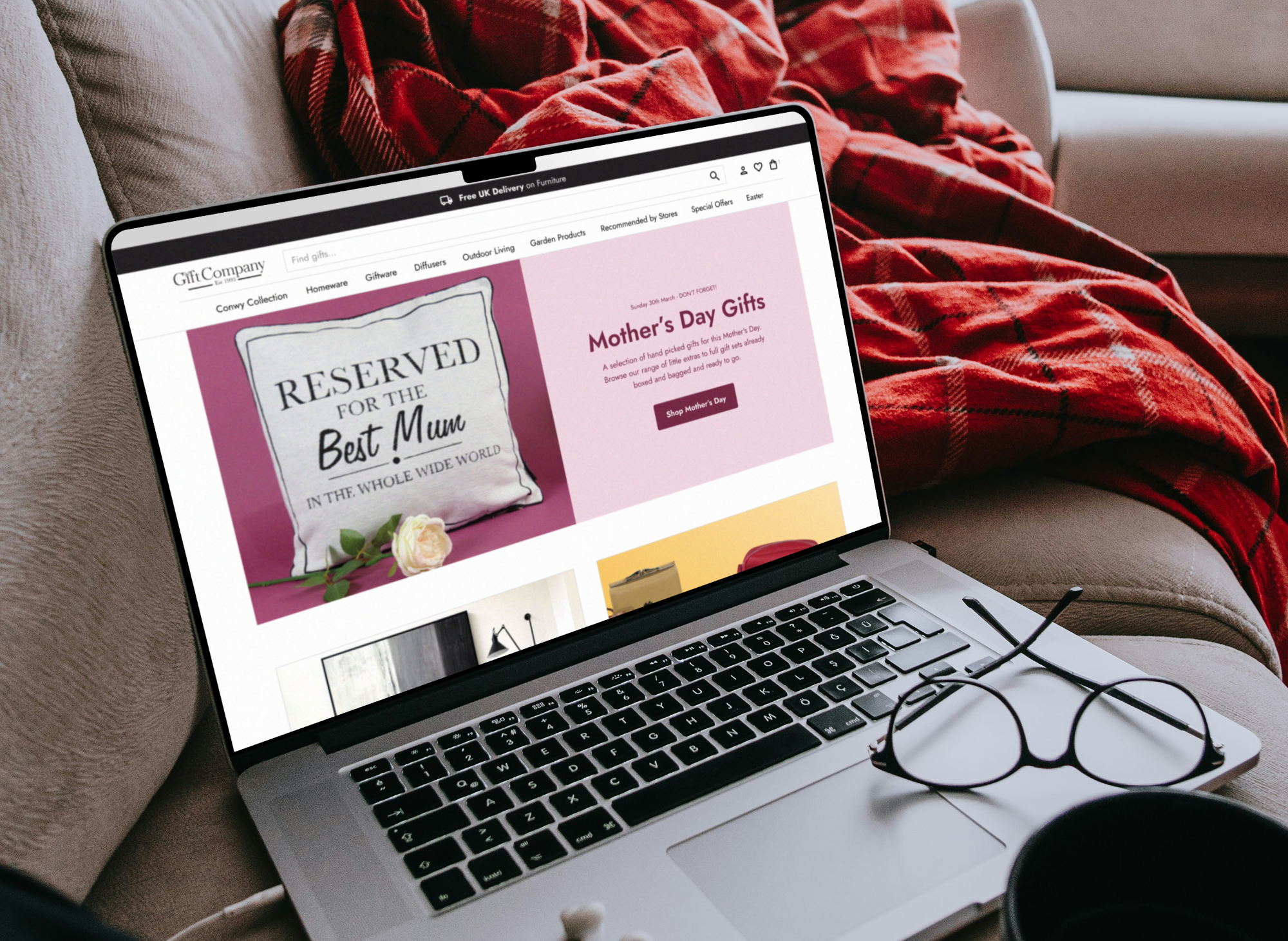 Gift Company website homepage displayed on a Macbook